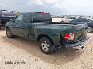 2001 Ford F-150 XL with VIN 1FTZX07271KB88709, listed as a IAAI auction lot 42599181 with 153,985 mi miles and . Bid and sale history available at DreamBid. Image 3.