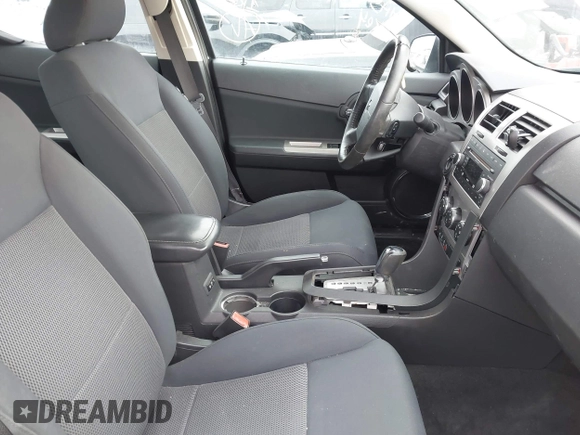 2009 Dodge Avenger SXT with VIN 1B3LC56B09N522736, listed as a IAAI auction lot 41195477 with 100,977 mi miles and . Bid and sale history available at DreamBid. Image 5.