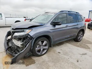 2020 Honda Passport Touring with VIN 5FNYF7H94LB003860, listed as a Copart auction lot 58833295 with 124,855 mi miles and Salvage title. Bid and sale history available at DreamBid. Image 1.
