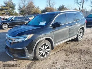 2019 Honda Pilot Touring 7-Passenger with VIN 5FNYF6H65KB061796, listed as a IAAI auction lot 41650857 with 122,417 mi miles. Bid and sale history available at carsss.com. Image 2.