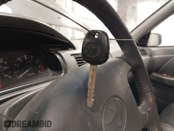 2001 Toyota Camry LE z VIN JT2BF28K110307972, wystawiony jako IAAI lot #41652522 z przebiegiem 201 631 mil mil oraz . Historia ofert i sprzedaży dostępna na DreamBid. Obrazek 11.