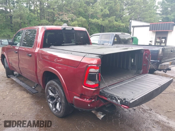 2023 Ram 1500 Limited with VIN 1C6SRFHM2PN509939, listed as a IAAI auction lot 42514018 with 31,669 mi miles and . Bid and sale history available at DreamBid. Image 3.