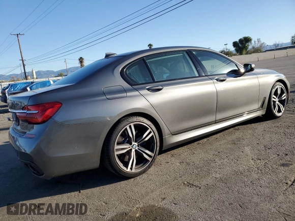2017 BMW 7 Series 740i with VIN WBA7E2C32HG740988, listed as a Copart auction lot 49613465 with 63,646 mi miles and Salvage Title. Bid and sale history available at carsss.com. Image 3.