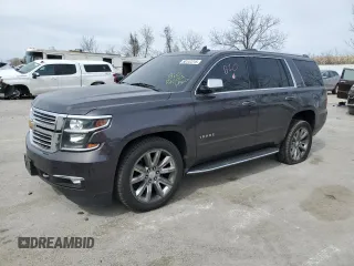 2016 Chevrolet Tahoe LTZ with VIN 1GNSKCKC5GR198762, listed as a Copart auction lot 50147215 with 156,735 mi miles and Salvage title. Bid and sale history available at DreamBid. Image 1.