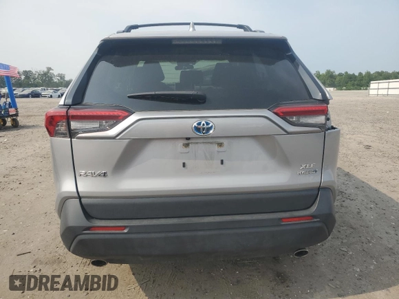 2023 Toyota RAV4 Hybrid XLE with VIN JTMRWRFV7PD166743, listed as a Copart auction lot 59964505 with 87,404 mi miles and Salvage title. Bid and sale history available at DreamBid. Image 6.