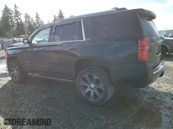 2015 Chevrolet Tahoe LTZ z VIN 1GNSKCKC5FR638011, wystawiony jako Copart lot #49269395 z przebiegiem 127 427 mil mil oraz Szkoda całkowita • Salvage title. Historia ofert i sprzedaży dostępna na DreamBid. Obrazek 2.
