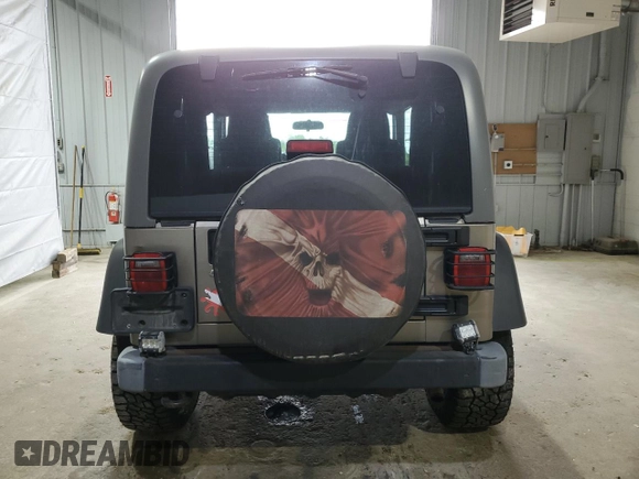 2005 Jeep Wrangler Sport z VIN 1J4FA49S75P325028, wystawiony jako Copart lot #56942315 z przebiegiem 169 988 mil mil oraz Szkoda całkowita • Salvage title. Historia ofert i sprzedaży dostępna na DreamBid. Obrazek 6.