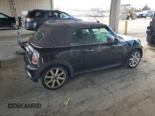 2014 MINI Convertible S with VIN WMWZP3C55ET706573, listed as a Copart auction lot 52325705 with 125,076 mi miles and Salvage Title. Bid and sale history available at DreamBid. Image 3.