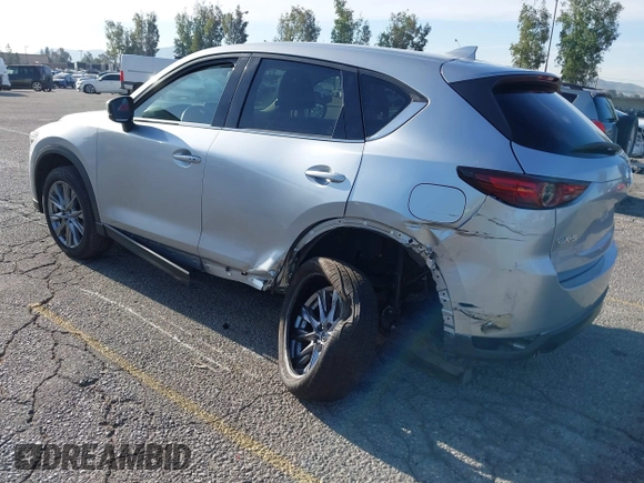 2021 Mazda CX-5 Grand Touring with VIN JM3KFADM1M1393251, listed as a IAAI auction lot 42072862 with 47,758 mi miles. Bid and sale history available at carsss.com. Image 3.
