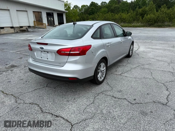 2017 Ford Focus SE with VIN 1FADP3F28HL28437, listed as a Copart auction lot 57904285 with 72,966 mi miles and Clean title. Bid and sale history available at DreamBid. Image 4.