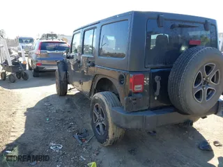 2012 Jeep Wrangler Unlimited Sport with VIN 1C4BJWDG5CL209978, listed as a IAAI auction lot 41662081 with 202,282 mi miles. Bid and sale history available at carsss.com. Image 3.