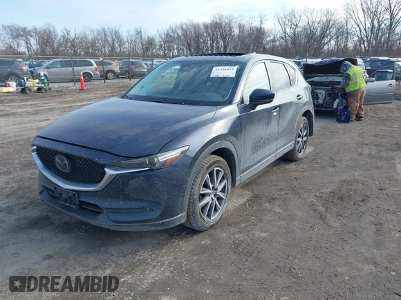 2018 Mazda CX-5 Grand Touring with VIN JM3KFBDM7J0338665, listed as a IAAI auction lot 41546019 with 141,740 mi miles. Bid and sale history available at carsss.com. Image 17.