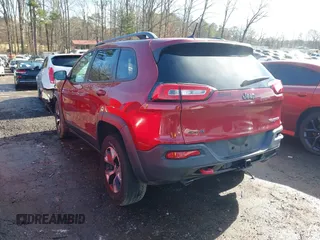 2014 Jeep Cherokee Trailhawk with VIN 1C4PJMBS0EW257133, listed as a IAAI auction lot 41446095 with 82,285 mi miles and . Bid and sale history available at DreamBid. Image 3.