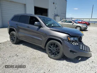 2018 Jeep Grand Cherokee Altitude with VIN 1C4RJFAG5JC320742, listed as a Copart auction lot 56988195 with 140,320 mi miles and Salvage title. Bid and sale history available at DreamBid. Image 4.