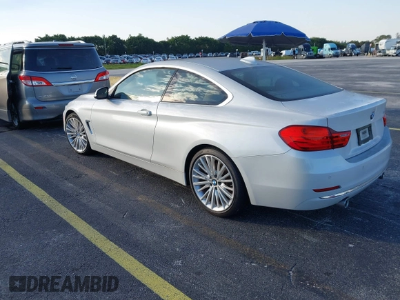 2014 BMW 4 Series 435i with VIN WBA3R1C51EK192795, listed as a IAAI auction lot 41263037 with 22,937 mi miles and . Bid and sale history available at DreamBid. Image 3.