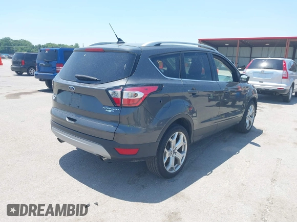 2018 Ford Escape Titanium with VIN 1FMCU9J99JUD43804, listed as a IAAI auction lot 41101250 with 56,438 mi miles and . Bid and sale history available at DreamBid. Image 4.
