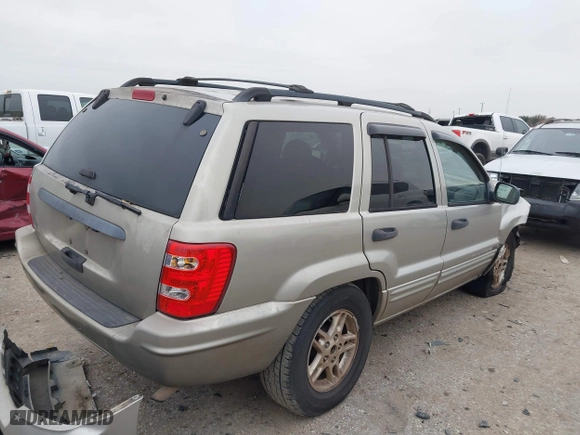 2004 Jeep Grand Cherokee Laredo with VIN 1J4GX48S44C301120, listed as a IAAI auction lot 41281556 with 267,246 mi miles. Bid and sale history available at carsss.com. Image 4.