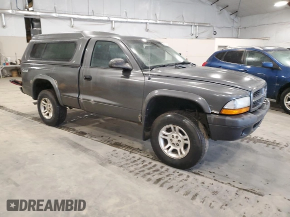 2003 Dodge Dakota z VIN 1D7GG16X23S204317, wystawiony jako Copart lot #54830745 z przebiegiem 139 508 mil mil oraz Szkoda całkowita • Salvage title. Historia ofert i sprzedaży dostępna na DreamBid. Obrazek 4.