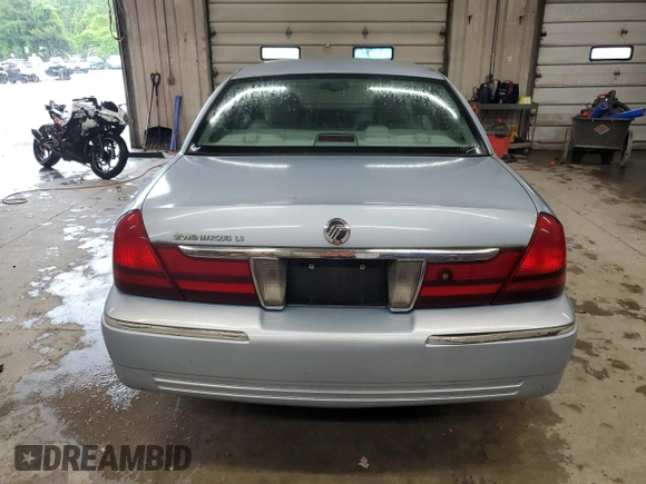 2003 Mercury Grand Marquis LS Premium z VIN 2MEHM75W33X645484, wystawiony jako Copart lot #58664585 z przebiegiem 145 064 mil mil oraz Czysty tytuł • Clean title. Historia ofert i sprzedaży dostępna na DreamBid. Obrazek 6.