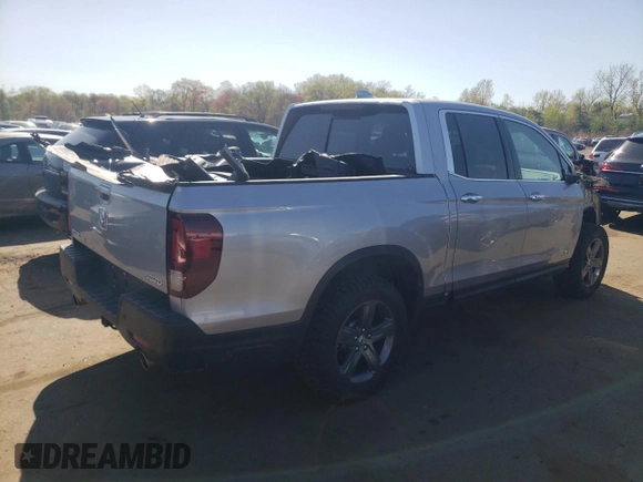 2023 Honda Ridgeline RTL-E with VIN 5FPYK3F77PB059763, listed as a Copart auction lot 54026045 with 34,114 mi miles and Salvage title. Bid and sale history available at DreamBid. Image 3.