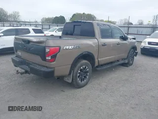 2021 Nissan Titan SL z VIN 1N6AA1ED6MN526285, wystawiony jako IAAI lot #41866324 z przebiegiem 80 524 mil mil oraz . Historia ofert i sprzedaży dostępna na DreamBid. Obrazek 4.