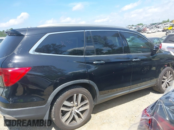 2017 Honda Pilot Touring с VIN 5FNYF5H9XHB024868, выставлен на аукционе IAAI как лот 42300608 с пробегом 133 018 миль миль и . История ставок и продаж доступна на DreamBid. Изображение 14.