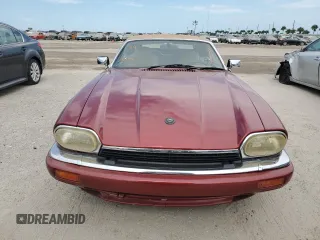 1995 Jaguar XJS with VIN SAJNX2742SC197388, listed as a Copart auction lot 76579714 with 99,077 mi miles and Salvage Title. Bid and sale history available at carsss.com. Image 5.