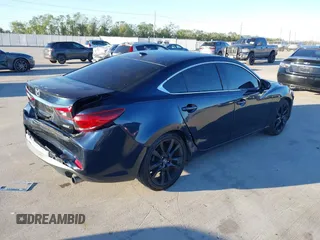 2015 Mazda 6 i Grand Touring with VIN JM1GJ1W58F1201507, listed as a IAAI auction lot 40916832 with 78,322 mi miles and . Bid and sale history available at DreamBid. Image 4.