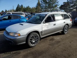 1998 Subaru Legacy Outback with VIN 4S3BG6859W6656677, listed as a Copart auction lot 86069594 with 194,564 mi miles and Salvage title. Bid and sale history available at DreamBid. Image 1.