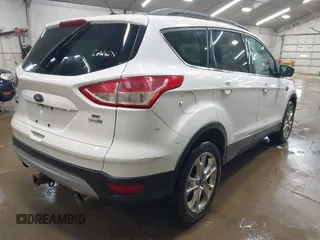 2014 Ford Escape SE with VIN 1FMCU9G99EUC15477, listed as a IAAI auction lot 42147162 with 98,886 mi miles and . Bid and sale history available at DreamBid. Image 4.