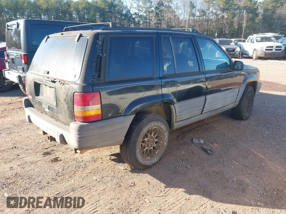 1998 Jeep Grand Cherokee Laredo with VIN 1J4FX58S7WC283734, listed as a IAAI auction lot 41267813 with 266,189 mi miles. Bid and sale history available at carsss.com. Image 4.