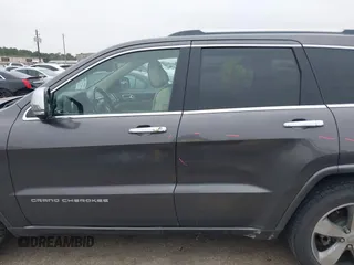 2014 Jeep Grand Cherokee Overland with VIN 1C4RJECG5EC207211, listed as a IAAI auction lot 41586309 with 115,293 mi miles. Bid and sale history available at carsss.com. Image 15.