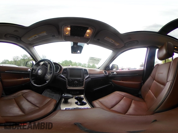 2015 Jeep Grand Cherokee Summit with VIN 1C4RJFJG5FC104087, listed as a IAAI auction lot 42100298 with 88,710 mi miles and . Bid and sale history available at DreamBid. Image 18.