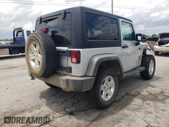 2012 Jeep Wrangler Sport z VIN 1C4AJWAG4CL185009, wystawiony jako Copart lot #61203395 z przebiegiem 93 534 mil mil oraz Szkoda całkowita • Salvage title. Historia ofert i sprzedaży dostępna na DreamBid. Obrazek 3.