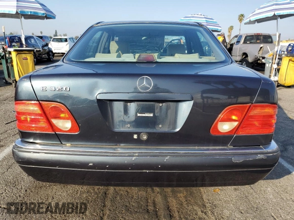 1997 Mercedes-Benz E 320 with VIN WDBJF55FXVA430115, listed as a Copart auction lot 43053715 with 158,057 mi miles and Clean Title. Bid and sale history available at DreamBid. Image 6.