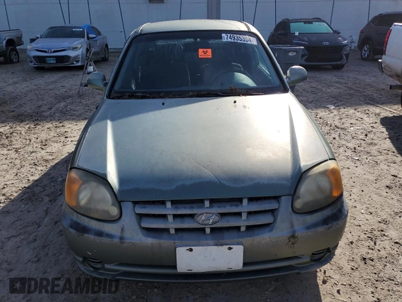 2005 Hyundai Accent GLS with VIN KMHCG35C75U328380, listed as a Copart auction lot 74935354 with 4,848 mi miles and Salvage Title. Bid and sale history available at carsss.com. Image 5.