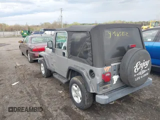 2002 Jeep Wrangler Sport with VIN 1J4FA49SX2P706691, listed as a IAAI auction lot 41965852 with 179,553 mi miles. Bid and sale history available at carsss.com. Image 3.