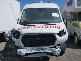 2022 Ford Transit Cargo with VIN 1FTBR1C80NKA05202, listed as a IAAI auction lot 42096686 with 75,302 mi miles and . Bid and sale history available at carsss.com. Image 12.