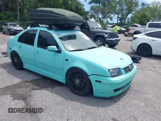 2005 Volkswagen Jetta GLI z VIN 3VWSE69MX5M051543, wystawiony jako IAAI lot #42706767 z przebiegiem 128 338 mil mil oraz . Historia ofert i sprzedaży dostępna na DreamBid. Obrazek 1.
