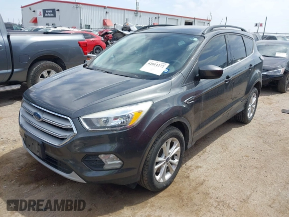 2018 Ford Escape SE z VIN 1FMCU9G98JUC13620, wystawiony jako IAAI lot #42011272 z przebiegiem 71 677 mil mil oraz . Historia ofert i sprzedaży dostępna na DreamBid. Obrazek 17.