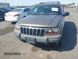 2001 Jeep Grand Cherokee Laredo with VIN 1J4GW48S81C694537, listed as a IAAI auction lot 42447828 with 162,981 mi miles and . Bid and sale history available at DreamBid. Image 6.