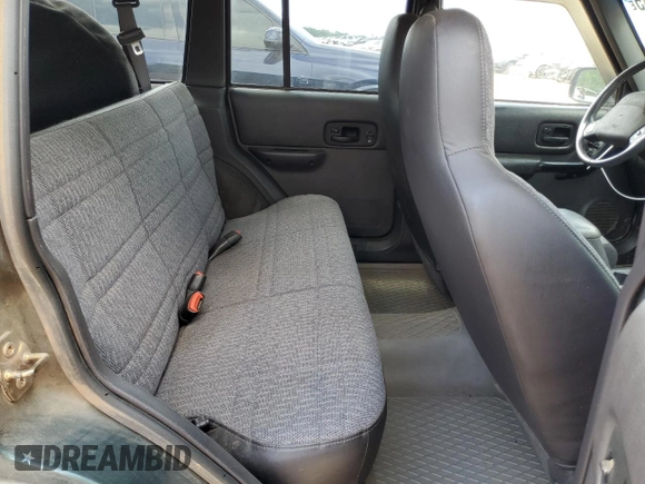 2001 Jeep Cherokee Sport with VIN 1J4FT48SX1L590135, listed as a Copart auction lot 53502945 with 362,941 mi miles and Non Repairable. Bid and sale history available at carsss.com. Image 11.