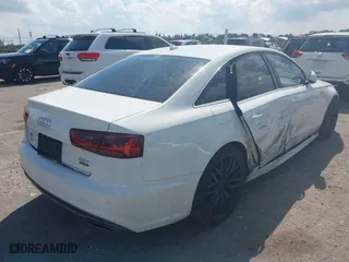 2016 Audi A6 3.0T Premium Plus with VIN WAUFGAFC9GN003664, listed as a IAAI auction lot 41890962 with 100,485 mi miles. Bid and sale history available at carsss.com. Image 4.