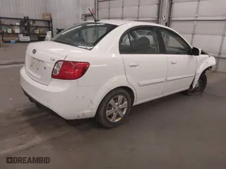 2010 Kia Rio LX with VIN KNADH4A34A6643439, listed as a IAAI auction lot 41808558 with 63,033 mi miles. Bid and sale history available at carsss.com. Image 4.