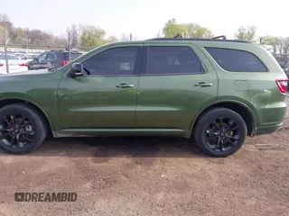 2021 Dodge Durango GT Plus with VIN 1C4RDJDGXMC663928, listed as a IAAI auction lot 42070119 with 77,110 mi miles and . Bid and sale history available at DreamBid. Image 14.