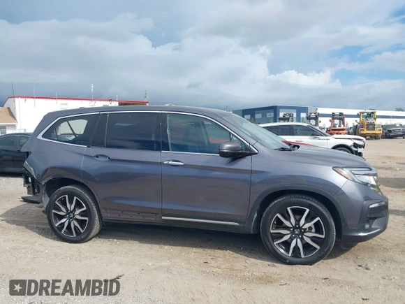 2022 Honda Pilot Elite with VIN 5FNYF6H04NB025212, listed as a IAAI auction lot 42430032 with 69,427 mi miles and . Bid and sale history available at DreamBid. Image 13.
