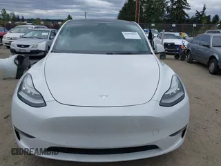 2021 Tesla Model Y Long Range with VIN 5YJYGDEE6MF082883, listed as a IAAI auction lot 42078807 with 64,953 mi miles. Bid and sale history available at carsss.com. Image 13.