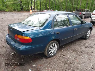 2000 Chevrolet Prizm LSi z VIN 1Y1SK5289YZ401584, wystawiony jako IAAI lot #42263210 z przebiegiem 151 567 mil mil oraz . Historia ofert i sprzedaży dostępna na DreamBid. Obrazek 4.