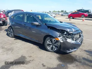 2018 Honda Civic EX-T z VIN JHMFC1F30JX018885, wystawiony jako IAAI lot #42386873 z przebiegiem 99 257 mil mil oraz . Historia ofert i sprzedaży dostępna na DreamBid. Obrazek 1.