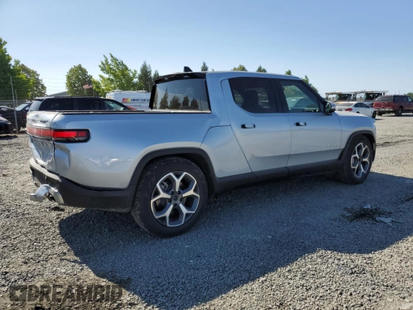 2023 Rivian R1T Adventure z VIN 7FCTGBAA0PN025046, wystawiony jako Copart lot #62502274 z przebiegiem 1385 mil mil oraz Szkody całkowita. Historia ofert i sprzedaży dostępna na DreamBid. Obrazek 3.